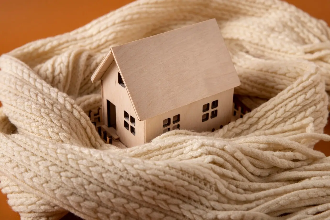 Cozy home concept featuring a wooden toy house